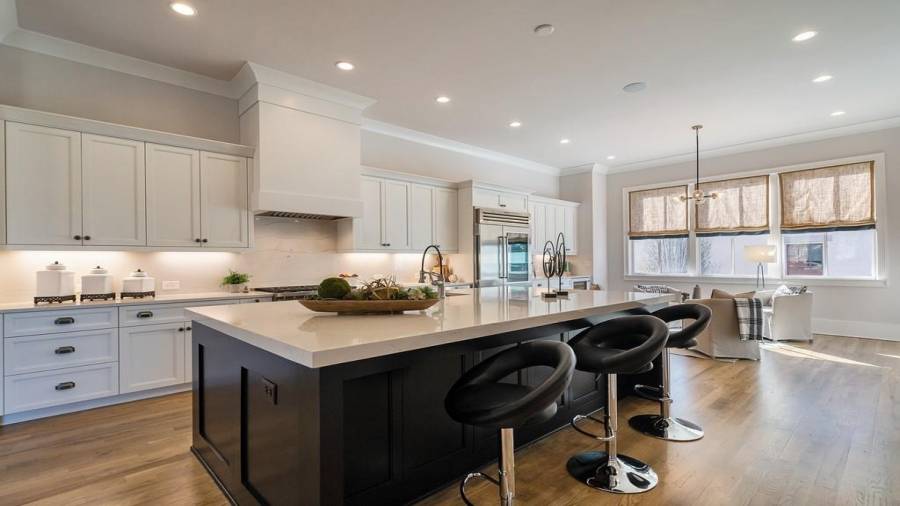The spacious and airy designers kitchen is accented with Stainless Steel appliances including a Wolf 36