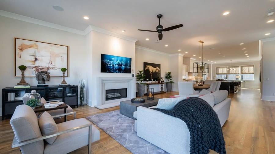 View from the living room featuring the full length of the main living level. The living room is closest to East Andrews, then the dining room, sleek kitchen and breakfast area and office nook.