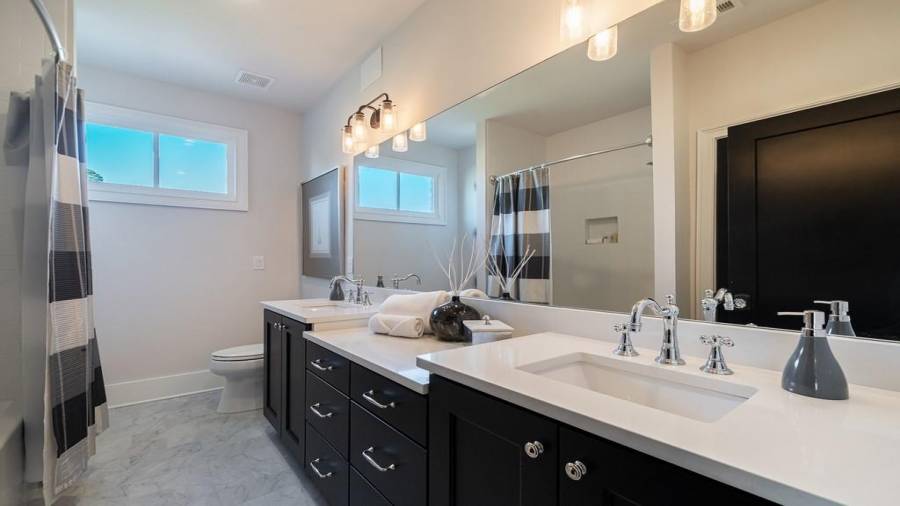 Guest full bathroom with Quartz counters on the upper level for bedrooms 2 and 3.
