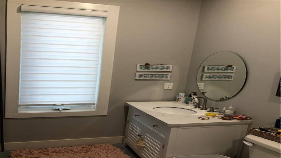 smaller bedroom and main shared to guests bath