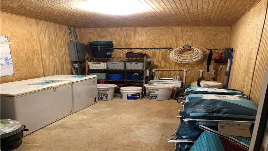 8x12 climate controlled feed room (tankless water heater and well compression bladder are located in the right back corner).
