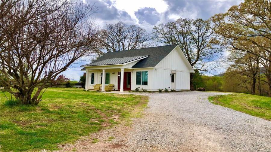 Side view where addition would be added to include drive under garage, entry zone and master bedroom/bath/closet
