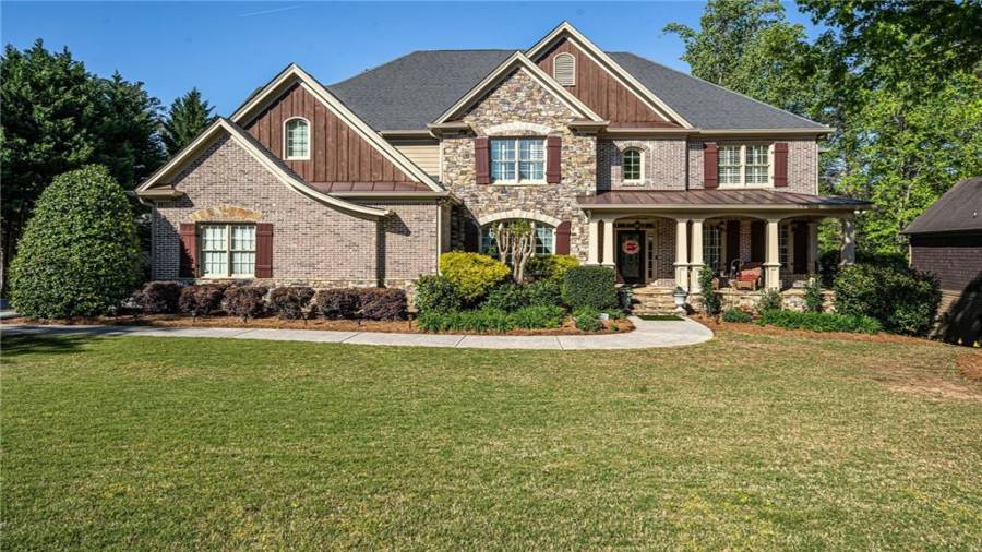 Lots of level front yard with with long Driveway