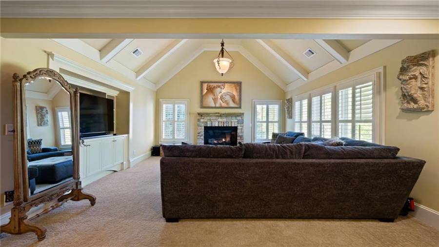 Master Sitting area w/ Vaulted Ceilings, Built Ins and a Fireplace!