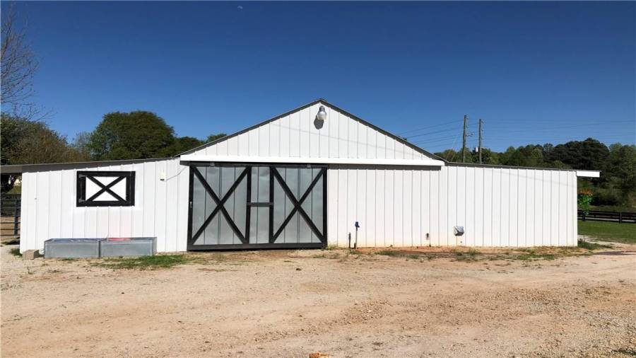 Main aisle entrance, view from the cottage. Water hydrant for additional quick water needs. Well is deep and puts out a ton of clean crisp mountain water.