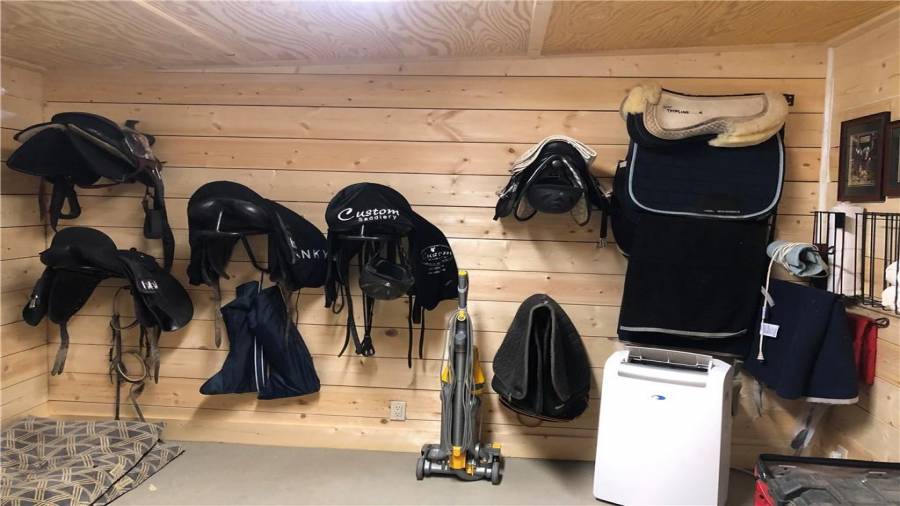 12x12 climate controlled tack room. there is also a mini fridge with a small top freezer for storage of cold beverages and any medications or treats that need to be kept cool. Mini fridge will remain as will the heating/cooling unit.
