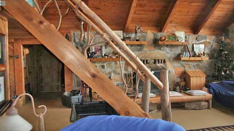 Staircase is hand wrought and hand fitted