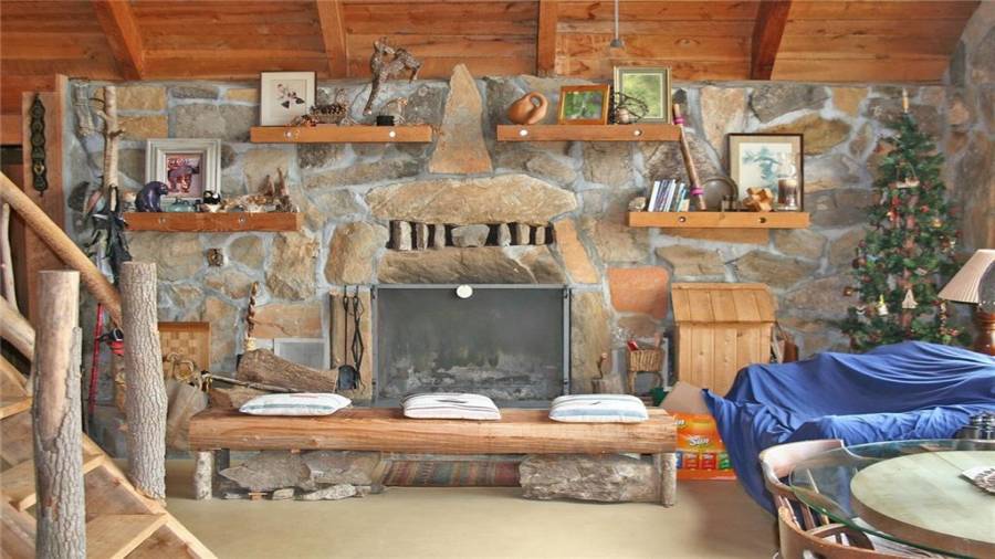 Large native-stone fireplace and hearth