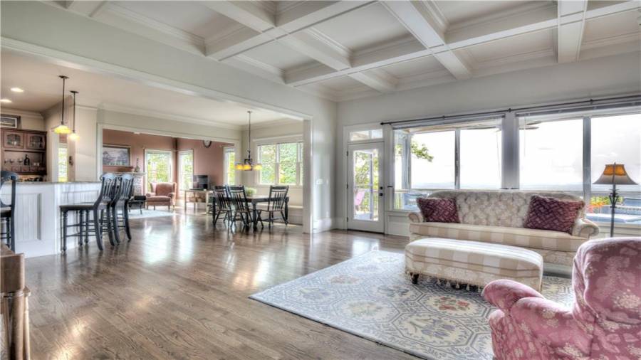 Huge Great Room and open floor plan that leads into the Kitchen, eating areas and Keeping Room. All with a wall of windows to enjoy the view!