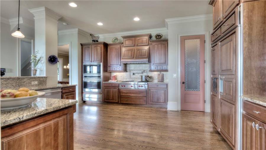 A master chef Kitchen with the Wolf and Sub-Zero appliances to boot! Gas cooktop, with pot filler and double oven/microwave