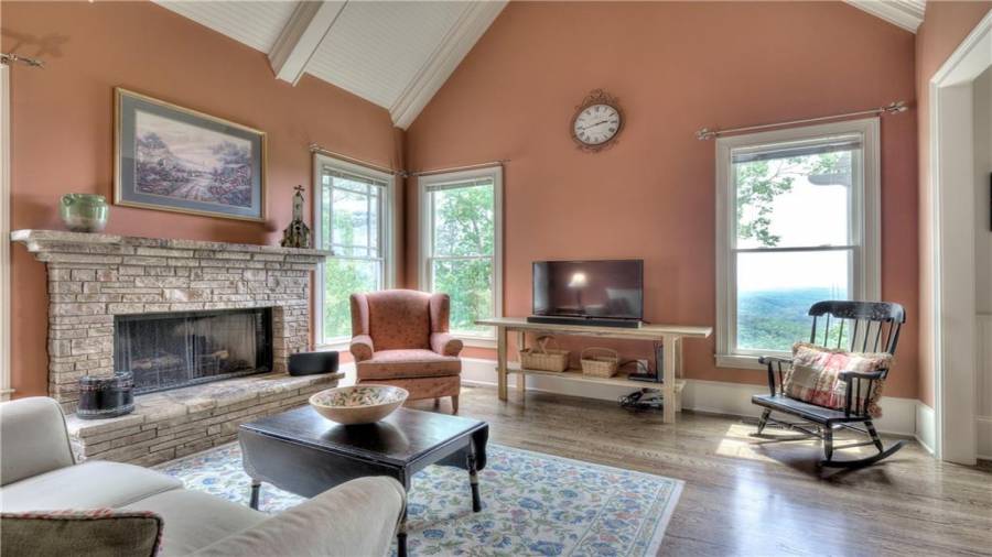 Spacious, yet cozy, Keeping Room off the Kitchen with gorgeous, custom stone fireplace and more windows with that view!