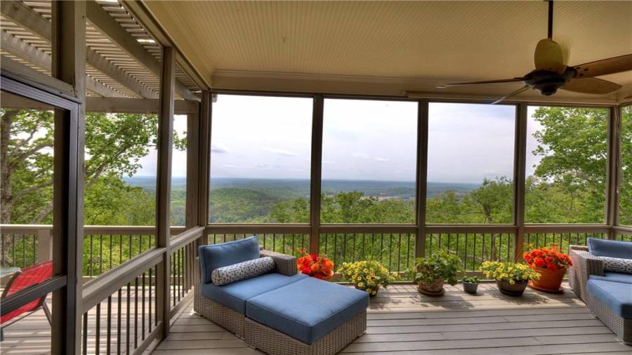 Porch with a view to boot! Screens were removed for painting. Your choice - owner will reinstall.