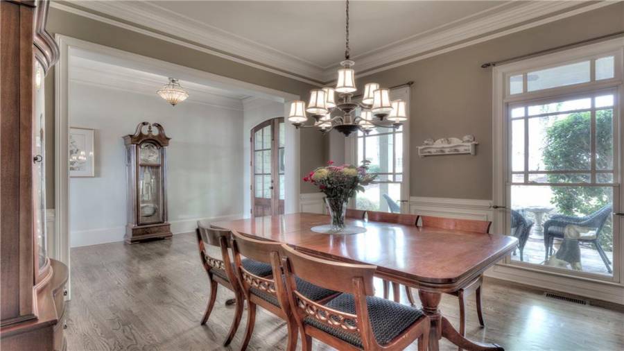 Natural lighting from the large windows floods into the dining room.