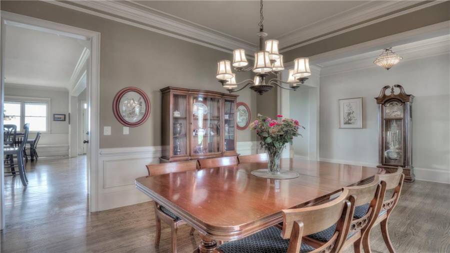 Plenty of room for dining room furniture including hutch and buffet.