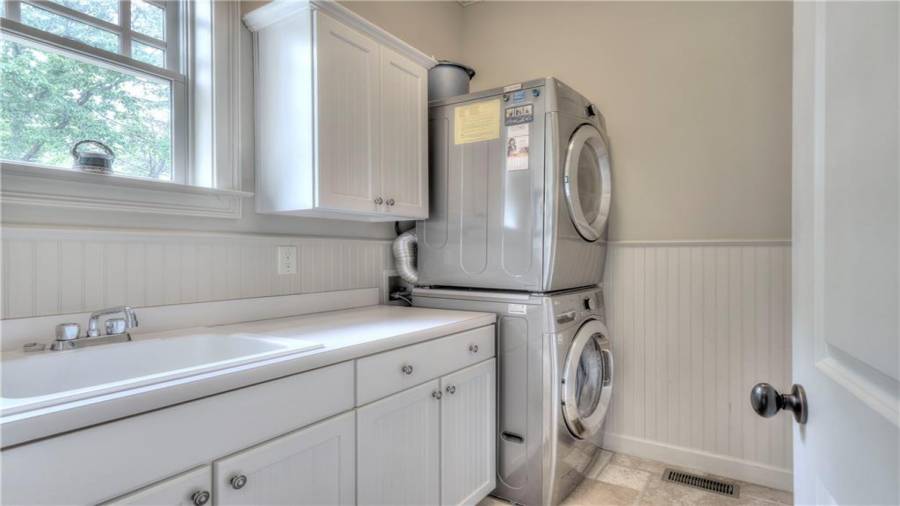 Convenient Laundry Room and Mudroom off the Kitchen with separate entry from the outside breezeway.Second Laundry on Terrace Level.
