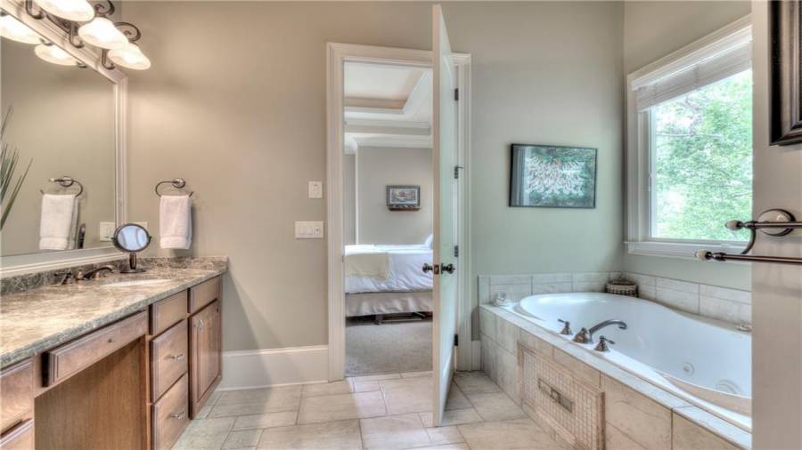 Enjoy the large garden tub with whirlpool and a large private window for natural light.