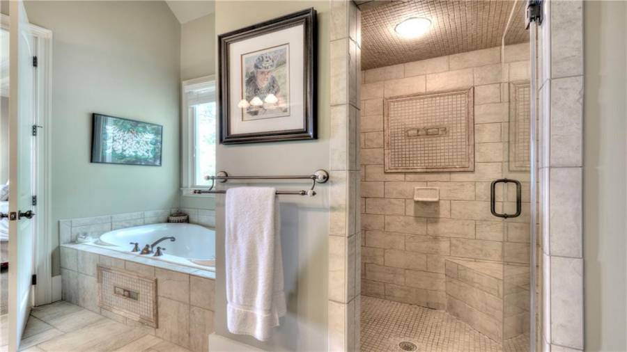 Large walk-in shower that is custom tiled from top to bottom!
