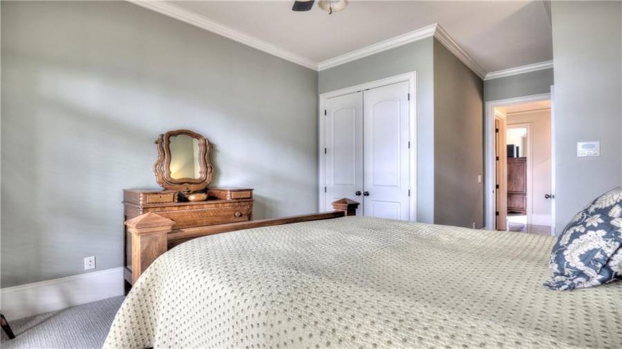 Spacious guest bedroom with plenty of closet storage.