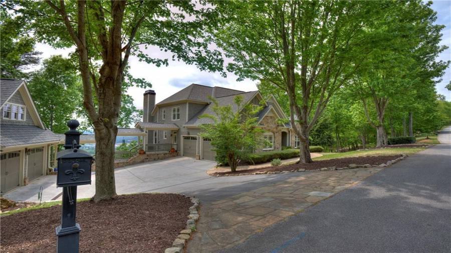 Flagstone driveway skirt and just look at that view through the breezeway from the detached garage to the main house.