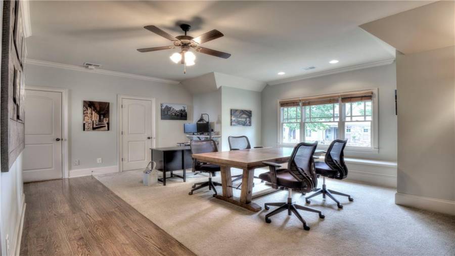 Upstairs entry office and conference room with plenty of natural light. Window seating, recessed lights, ceiling fan, and two closets - more storage!