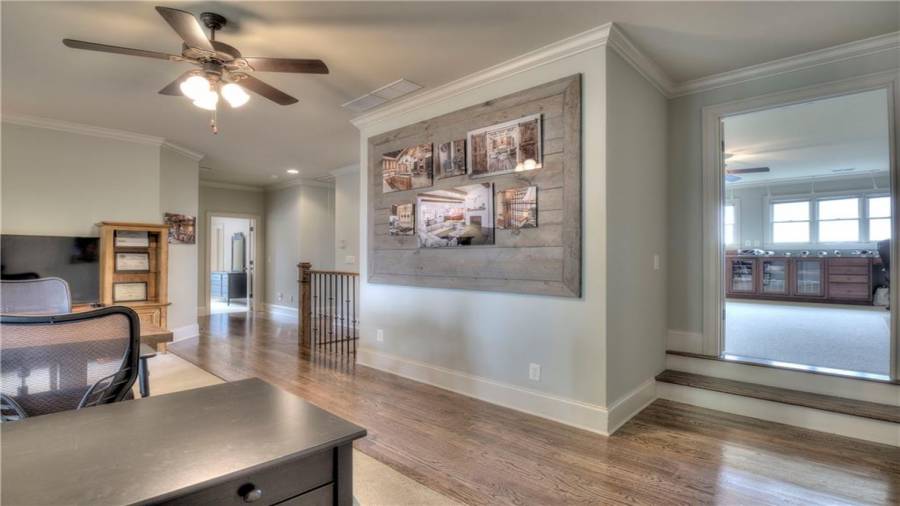 Notice the crown molding, tall shoe moldings, hardwoods in walkways. Area is also perfect for a Playroom or Guest living area.