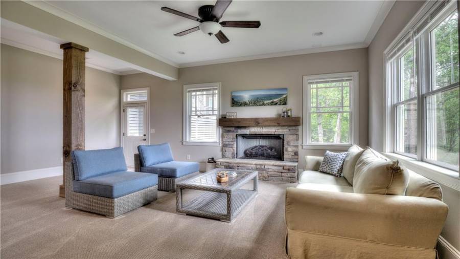 Your fourth fireplace with pretty stone and mantel.