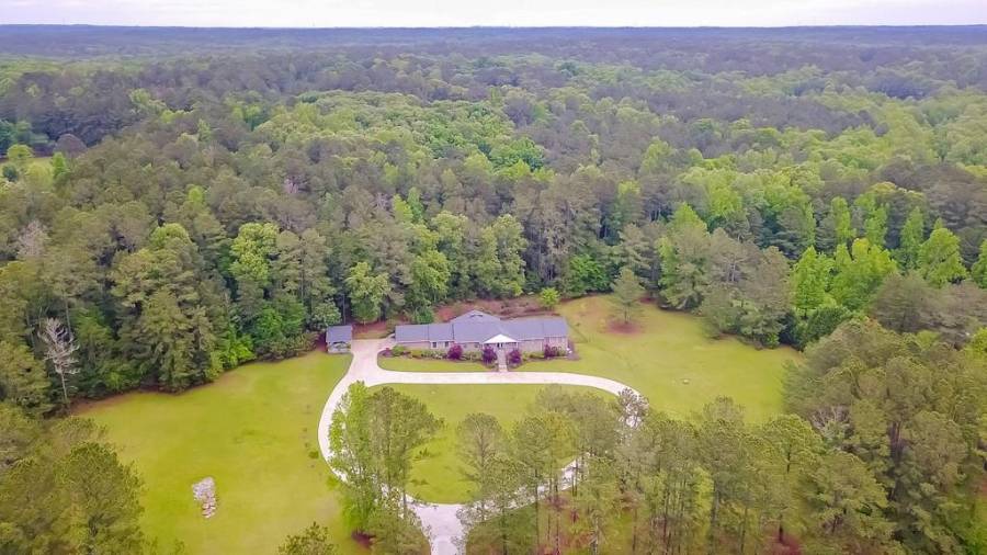 Incredible custom raised ranch sitting on over 5 acres