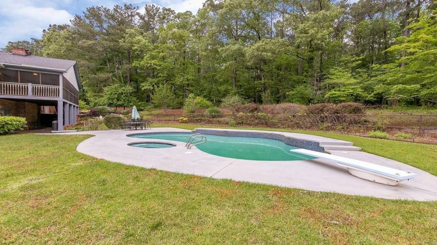 Fenced pool/spa area with paved space to spread out your towel on
