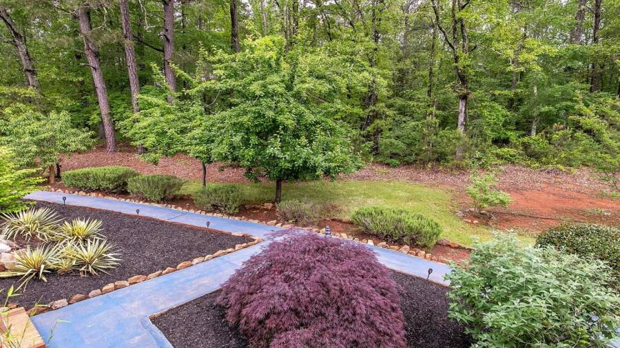 View of green space from screened in deck area