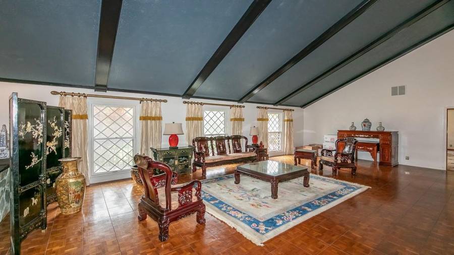 Ballroom like living room and dining room with fireplace