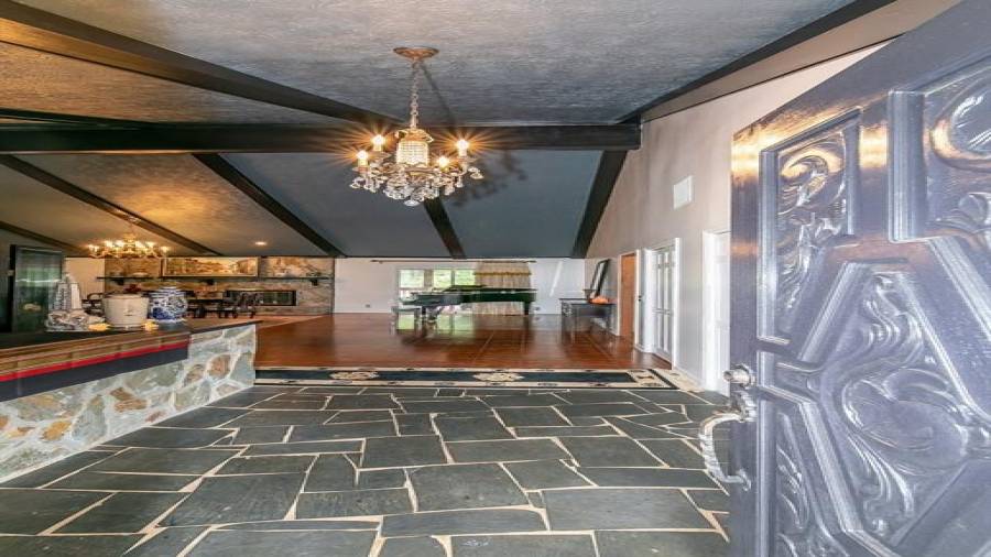 Front entry into vaulted living/dining room