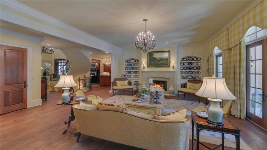 Additional view of the living room showcasing the custom built-ins.