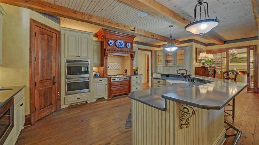 Additional view of the kitchen and door to walk in pantry.