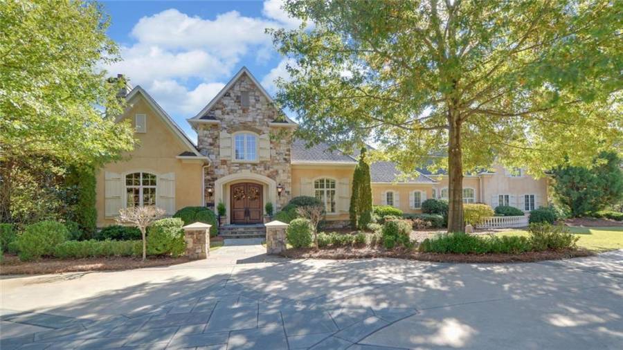 Hard coat stucco and stone give this home a European flair.