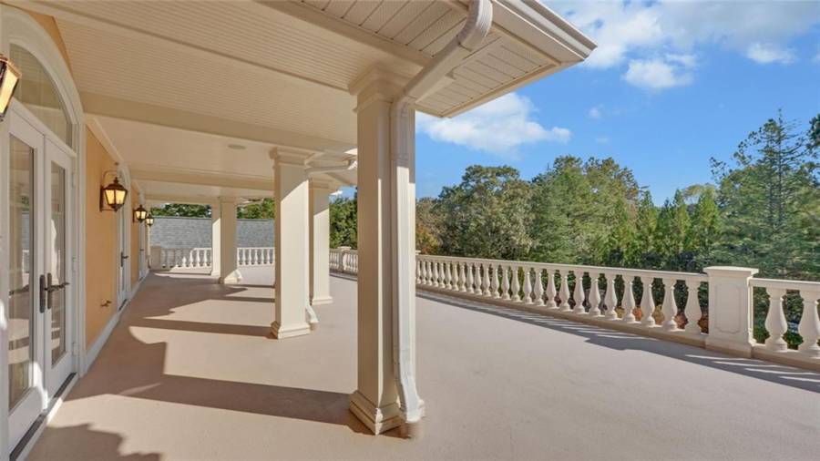 The veranda can be accessed from either ensuite on the upper level and offers great views of the gardens and pool.