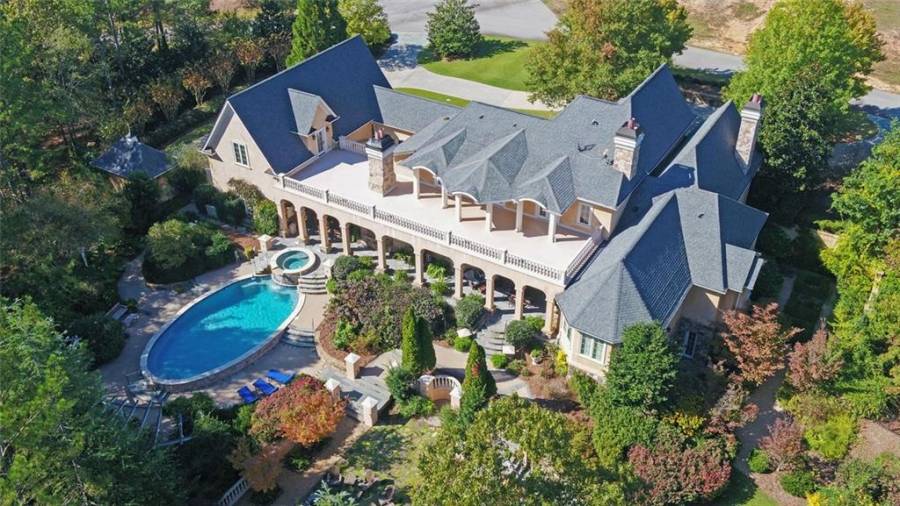 The back exterior of the home gives you a much better feel for the size of both the home, gardens and outdoor entertaining space.