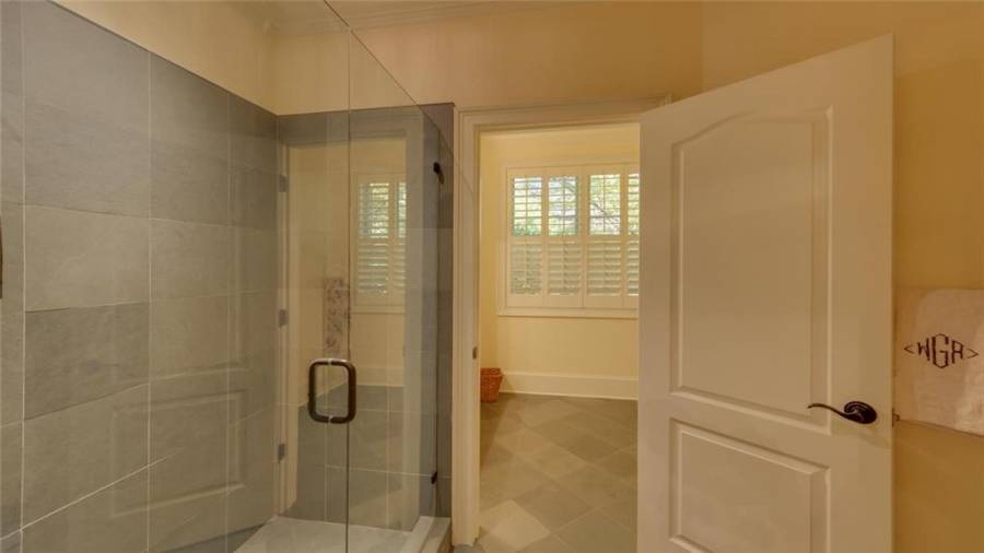 Large tiled shower in the terrace guest suite.