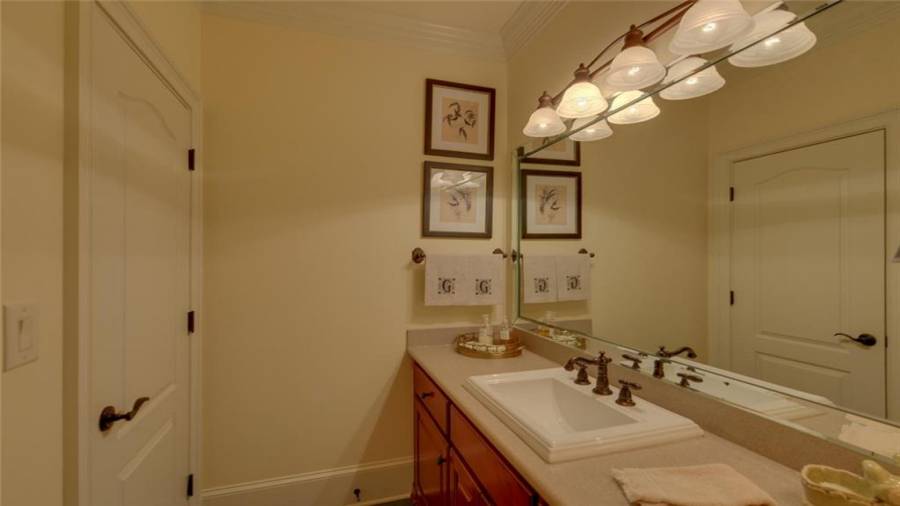 Second vanity area in the terrace level bath easily accessed from the bar area.