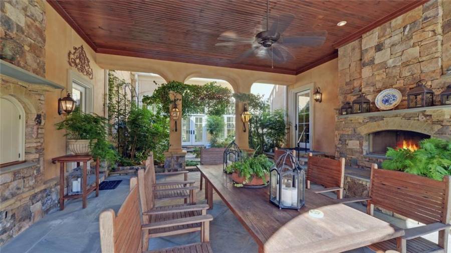 Enjoy outdoor dining in this beautiful space enhanced by gas lanterns and a stone fireplace perfect for crisp fall evenings.