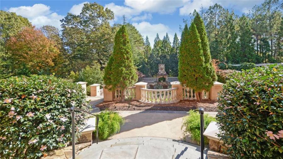 Walkway to various sitting areas, pool and spa.
