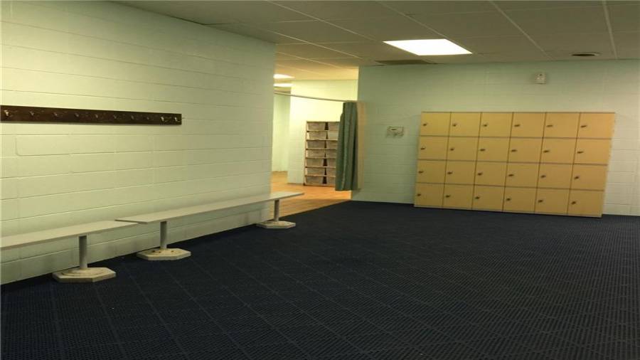 Mens locker room with showers and rest rooms.