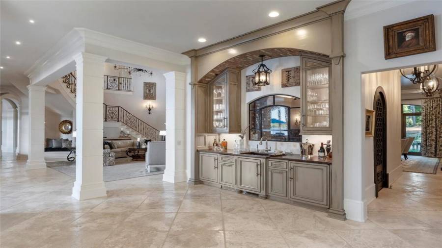 Bar area situated between the living room, dining room, and kitchen.