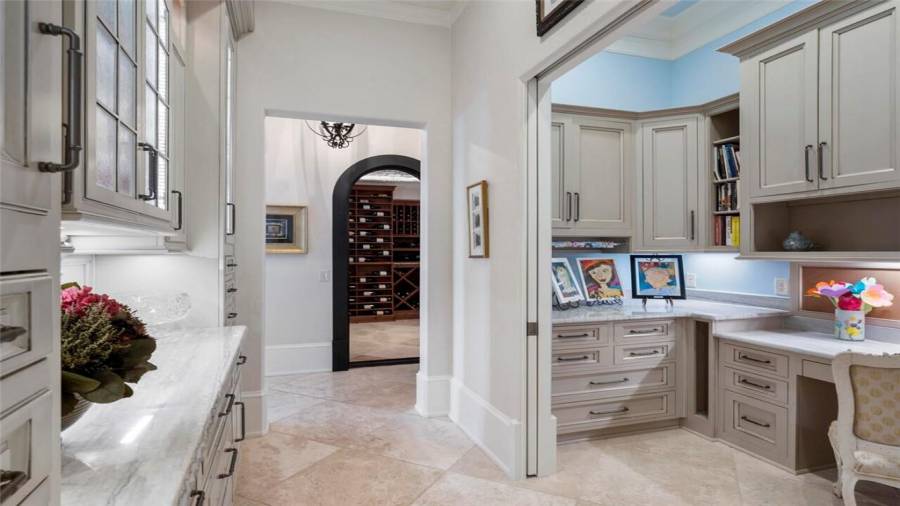 Home office, virtual study and butlers pantry next to kitchen and wine room.