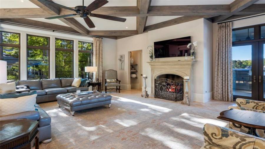 12 foot floor to ceiling windows and Scagliola cast stone fireplace in the family room.