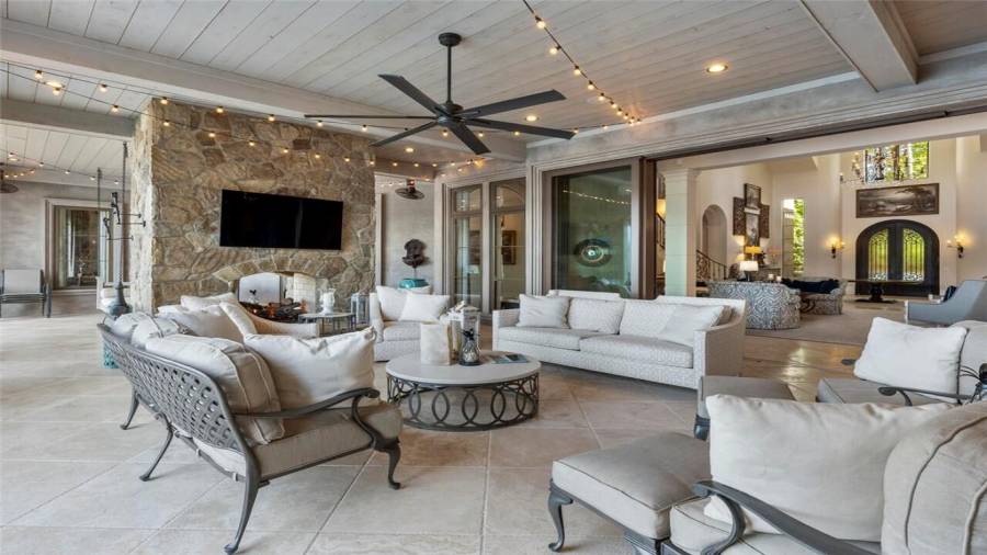 Sliding doors open from the indoor living areas to the outdoor living areas.