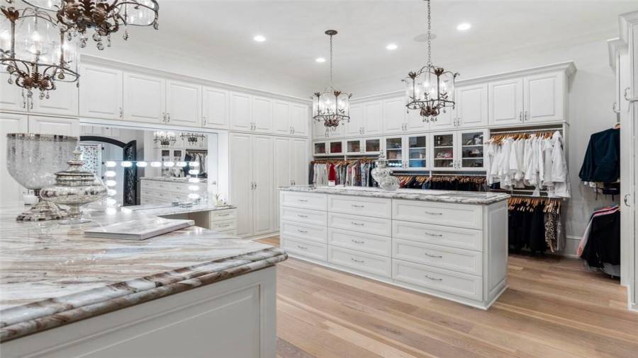 Storage island and custom organization cabinetry in the dressing room.