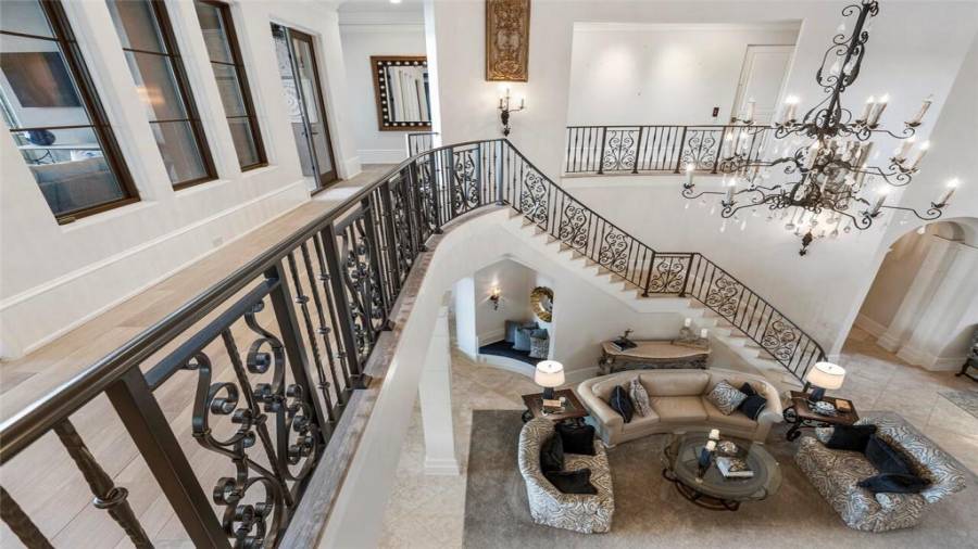 Upstairs are four bedroom suites, bar and entertaining area, and home theatre.