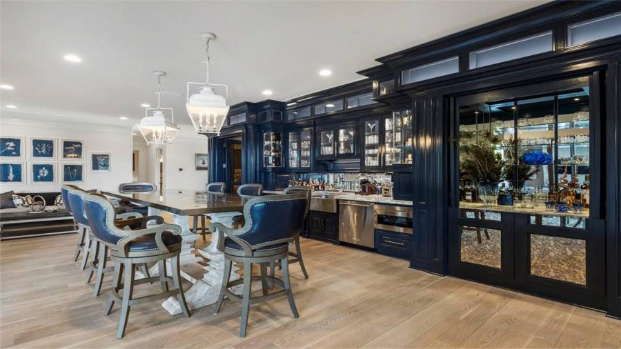 Blue lacquered bar with mirrored paneling is exquisite.