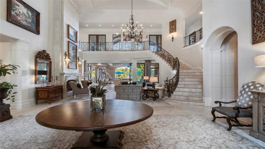 30 foot foyer opens to living room and views of the lake.