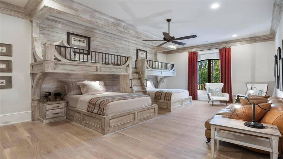 Upstairs bunk room with custom woodwork. Two double beds with two twin beds on top.